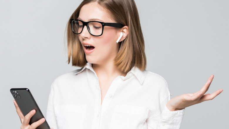 Woman talking on phone with AirPods
