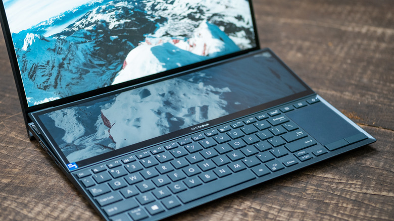 Asus Zenbook duo on a wood tabletop
