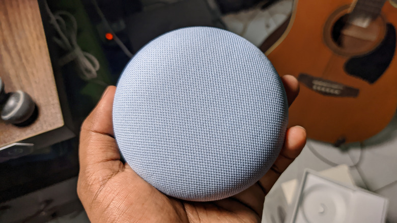 User resetting a Google Nest speaker