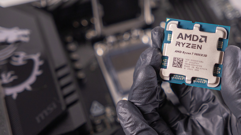 AMD Ryzen 7 9800X3D processor held in hand