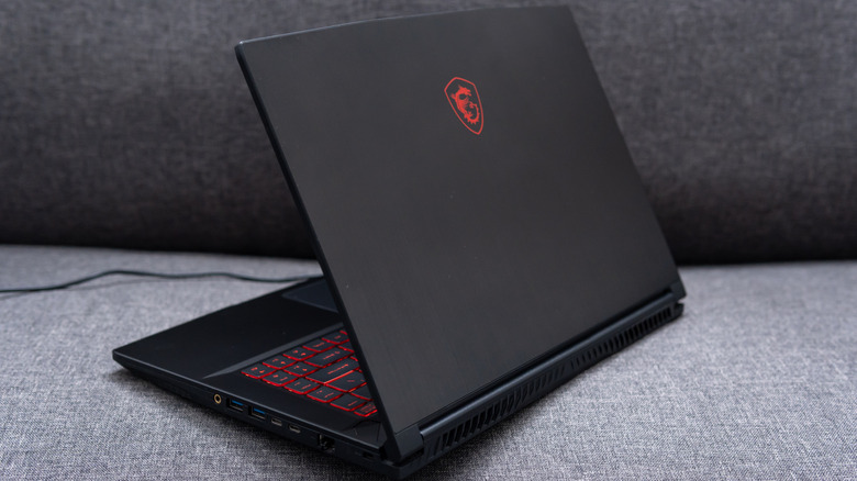 An MSI 6F65 Thin gaming laptop on a sofa