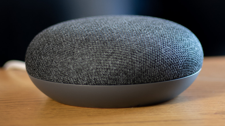 Google Home Mini on a wood coffee table