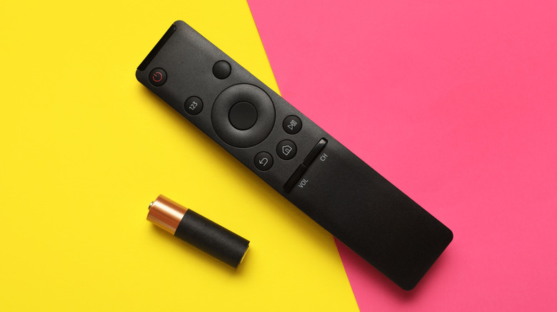 Remote TV next to one AA battery