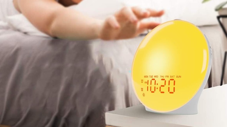 The JALL Sunrise Alarm Clock being used in a bedroom setting.