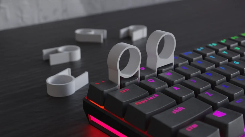 A pair of 3D printed mechanical keyboard keycap pullers.