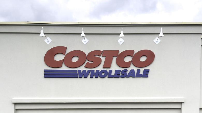 An image of the outside of a Costco Wholesale building, showcasing the the company's blue and red logo