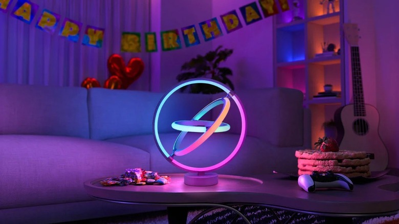 Lepro TB1 AI Smart Table Lamp on coffee table with birthday party decorations in the background