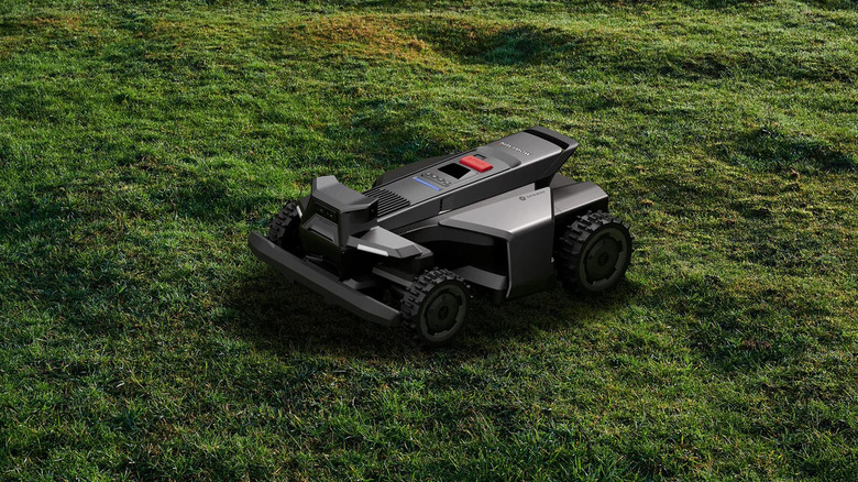 Segway Navimow X430 Robotic Lawn Mower mowing on patchy lawn