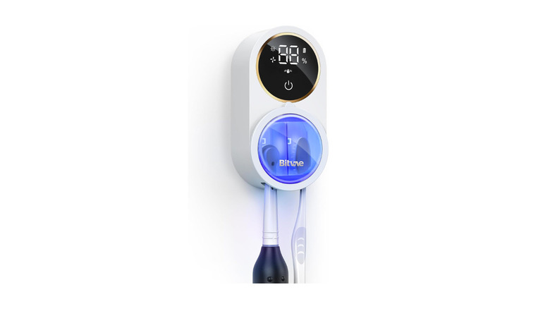 Toothbrush holder with digital screen and UV light