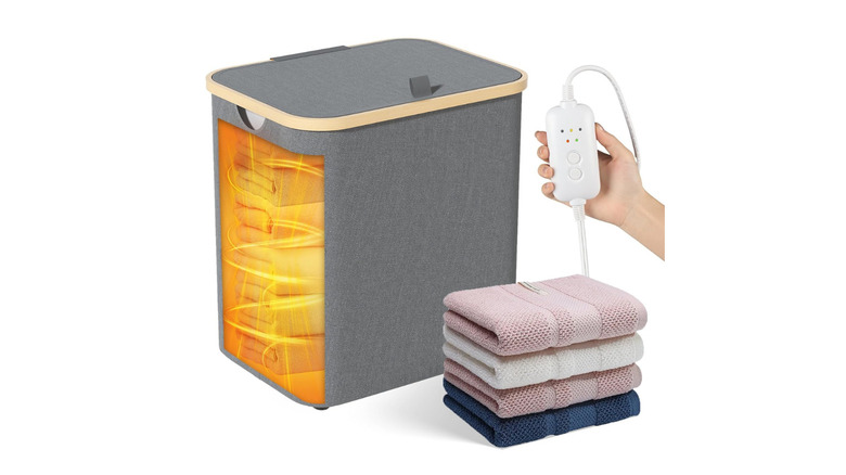 A grey fabric bin warming towels inside