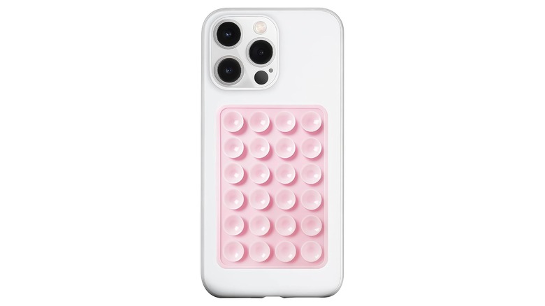 an Amazon Promotional photo for a pink Anteel Silicone Suction Case Mount from LvShuLiangPin, the mount is adhered to the back of a white iPhone