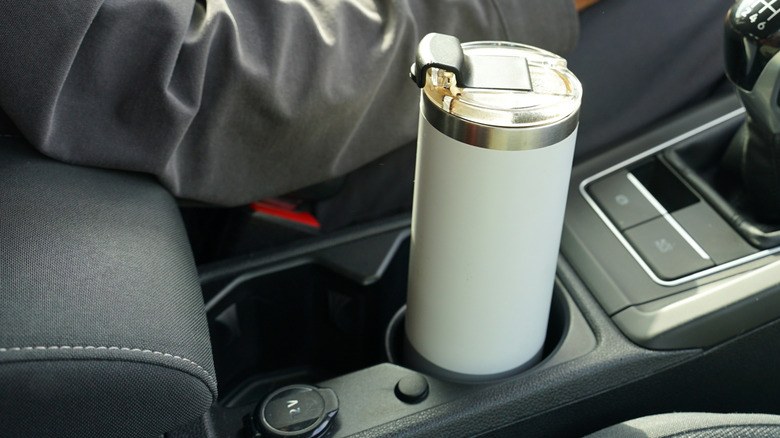 A large tumbler in a car cup holder