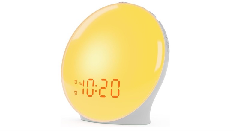 JALL Wake Up Light Sunrise Alarm Clock is pictured, exhibiting a warm yellow glow.
