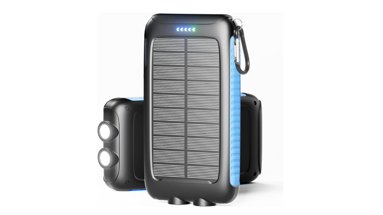 Portable solar powered battery pack on white background