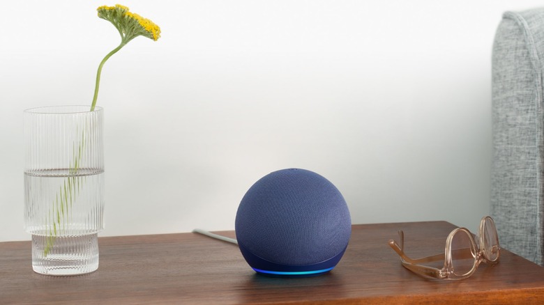 Blue Amazon Echo Dot on wooden table