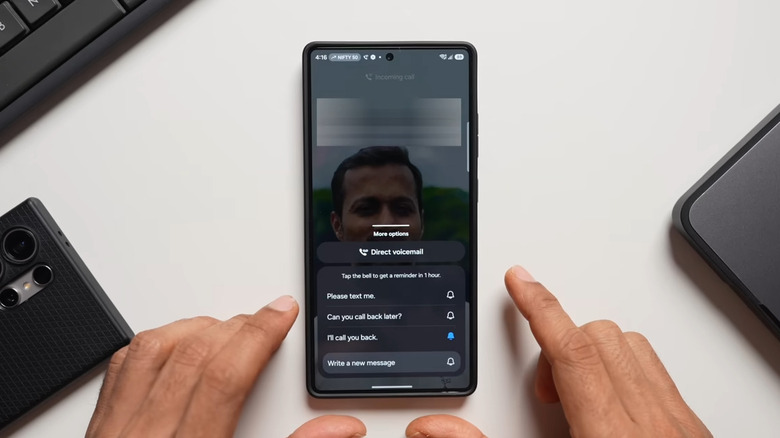 Samsung Galaxy phone on table with incoming call and Direct voicemail button