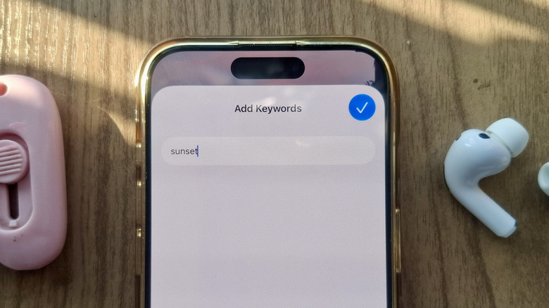 iPhone showing keyword for photo as new iOS 27 Photos feature