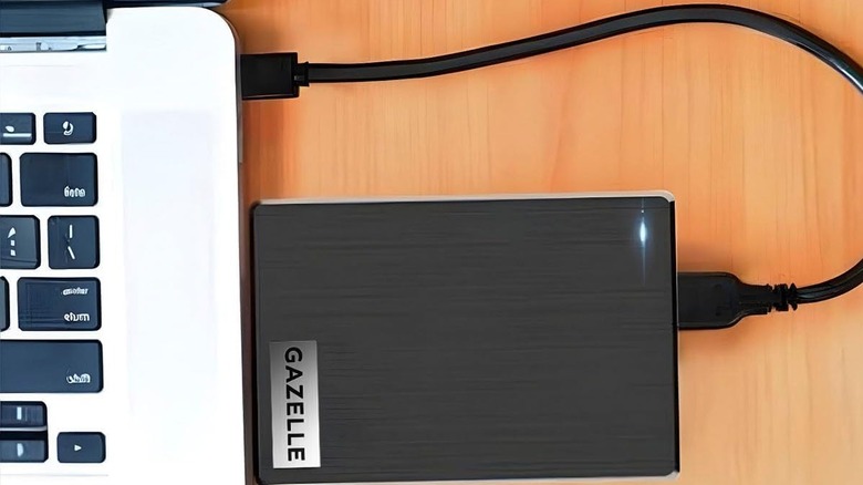 A Gazelle external hard drive plugged into a laptop.