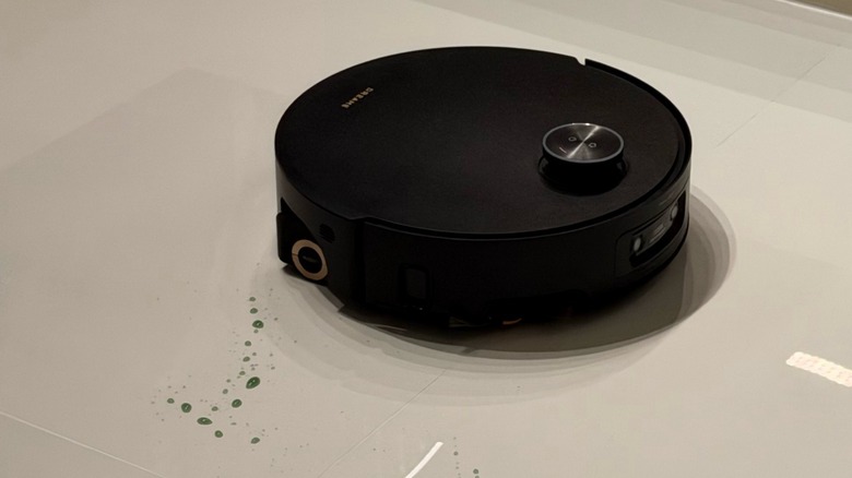 Close-up shot at robot vacuum cleaning the floor