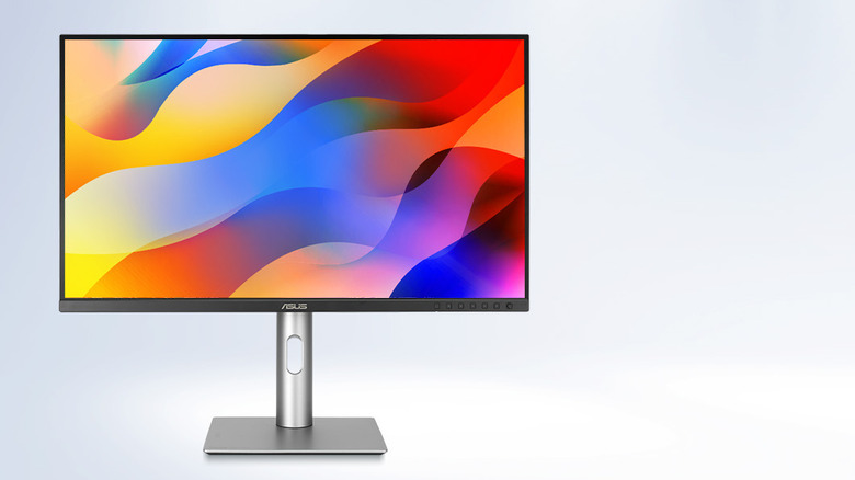 ASUS ProArt display showing a colorful abstract wallpaper.