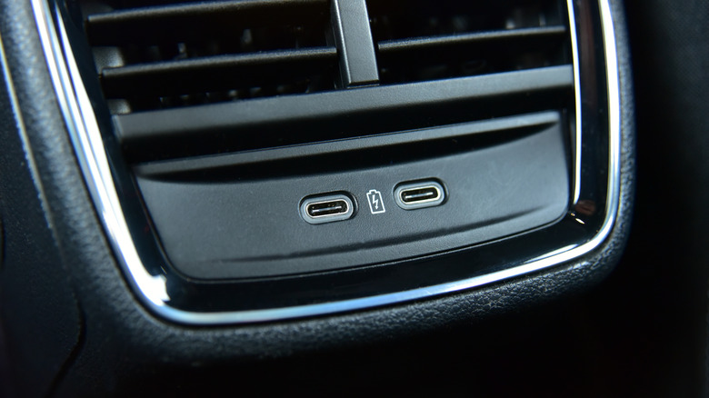 Two USB-C ports seen below the AC vents in a car