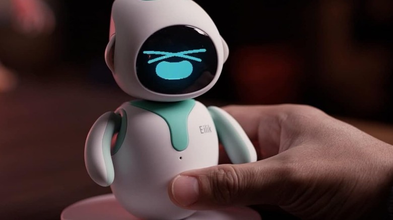 Poking the belly on the Eilik desk robot.