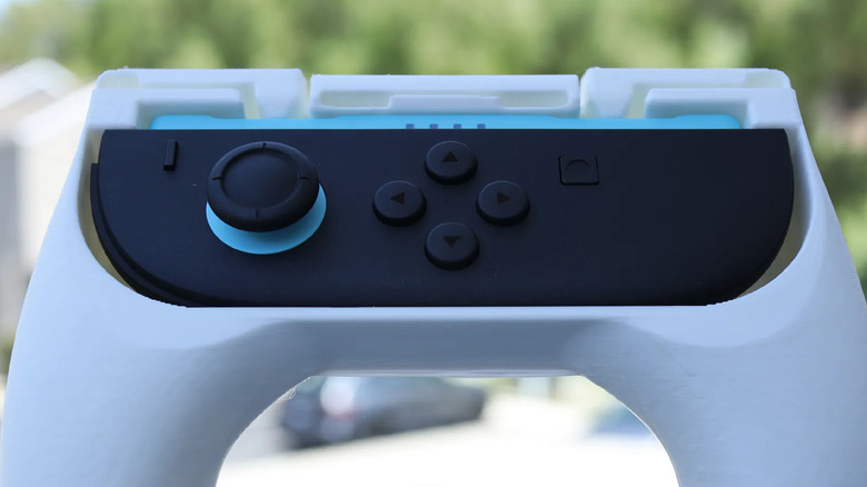 Nintendo Switch 2 Joy-Con attached to a custom grip accessory for improved handling.