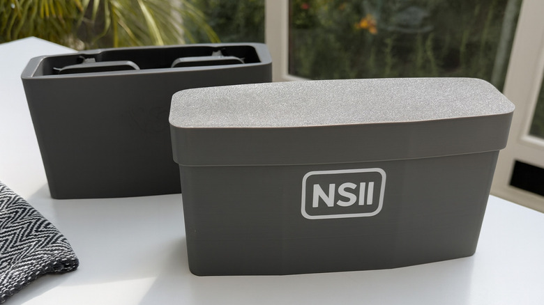 Nintendo Switch 2 storage case on a table with detachable inner compartments.