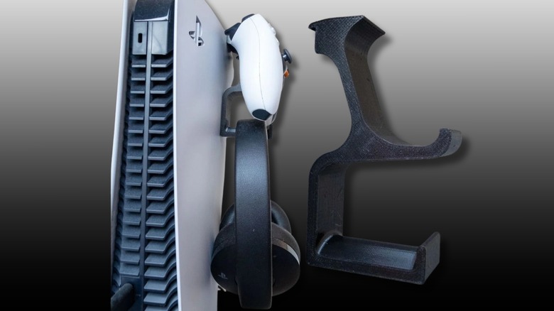 PlayStation 5 Slim with the clip-on controller and headset holder