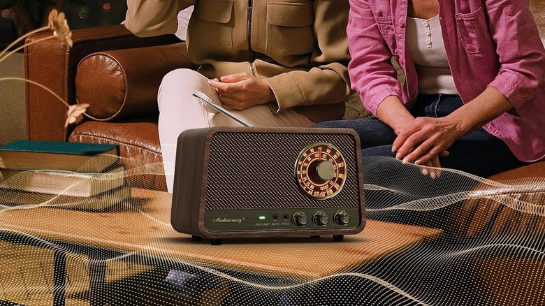 Women listening to Audiocrazy Vintage Wooden AM FM Bluetooth Radio on coffee table