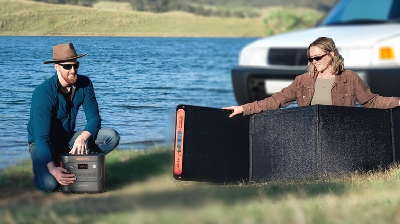 Jackery Explorer 2000 v2 and Solar Panels being spread out on grass