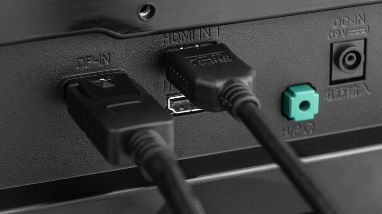 HDMI and DisplayPort cables connected to monitor inputs
