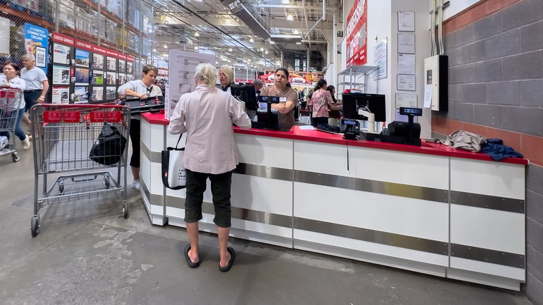 Shoppers pushing carts outside a Costco Wholesale store