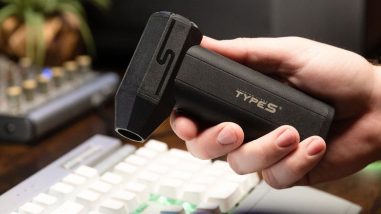 Using the Type S 4-in-1 electric air duster to clean a keyboard