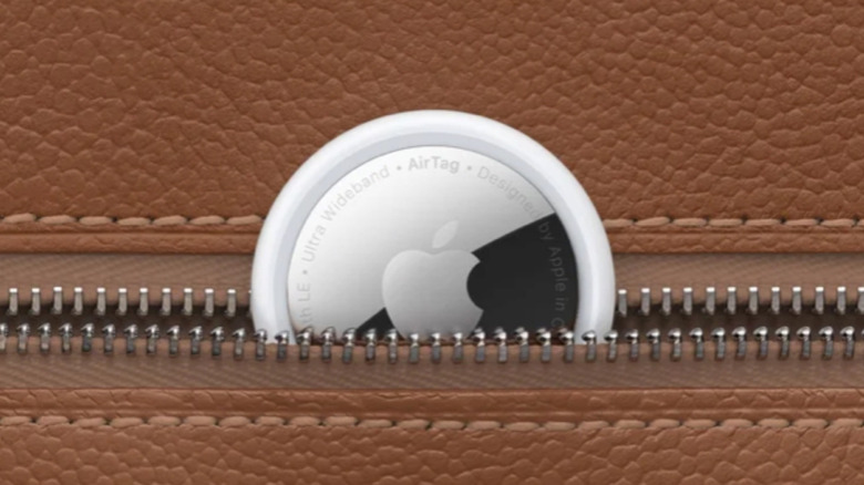 An Apple AirTag placed inside a bag pocket.