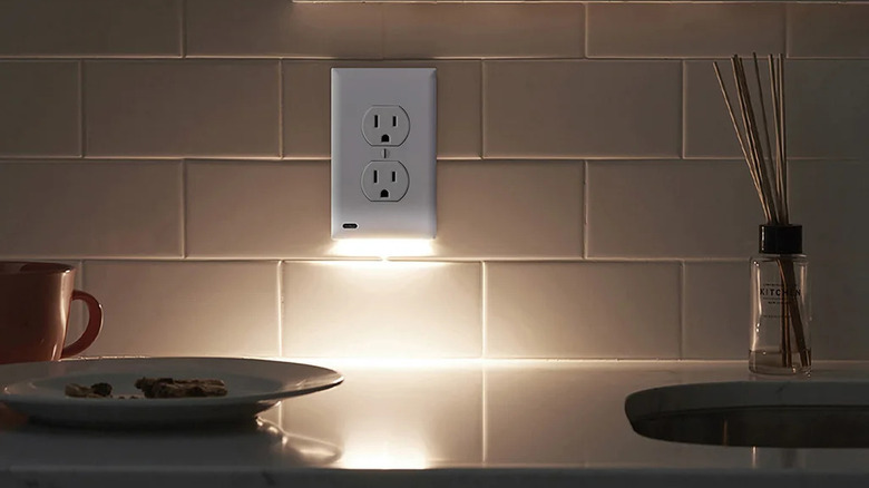 SnapPower GuideLight 2 LED Outlet Cover (3-Pack) installed on three outlets in a kitchen.