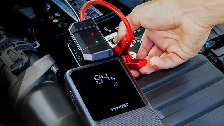 The TYPE S 8600mAh Jump Starter & Portable Power Bank being used to jumpstart a battery.