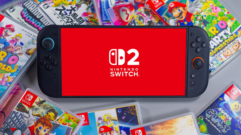 Nintendo Switch 2 on top of game cases