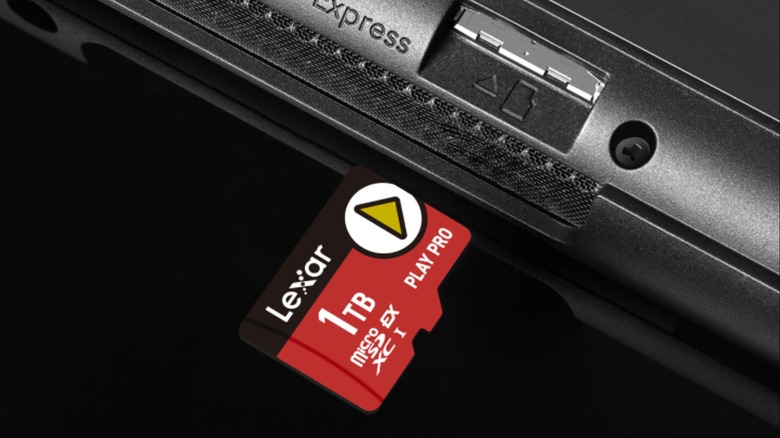 Lexar 1TB PLAY PRO microSDXC Express microSD card being inserted into a Nintendo Switch 2 console