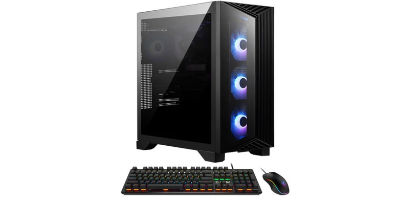 The MSI Aegis powered on in front of a mouse and keyboard