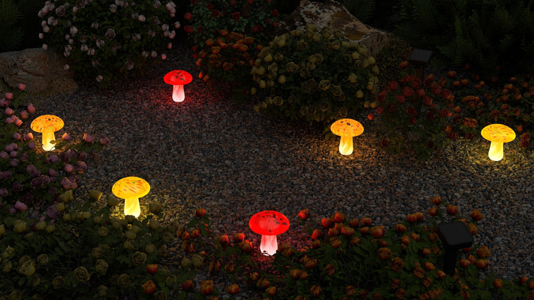 Sets of Infinity X1 Glass Solar Mushroom Landscape Lights planted in the ground.