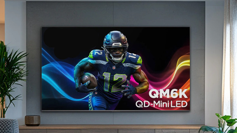 65-inch TCL QM6K TV mounted on a wall