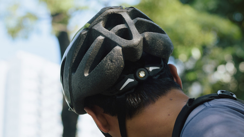 cyclist wearing a helmet looking away
