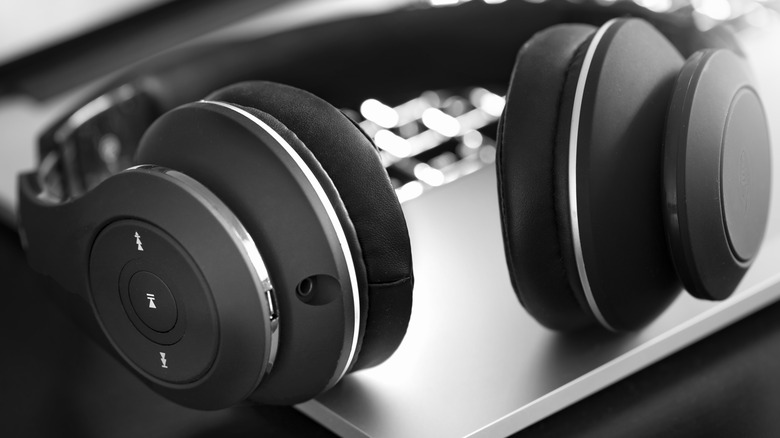 wireless headphones on a silver laptop