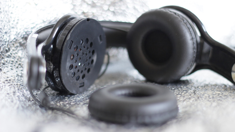 black headphones with the earpiece removed