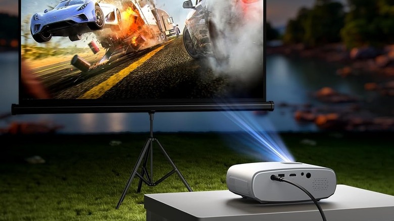 Elephas Mini Projector projecting movie of cars crashing