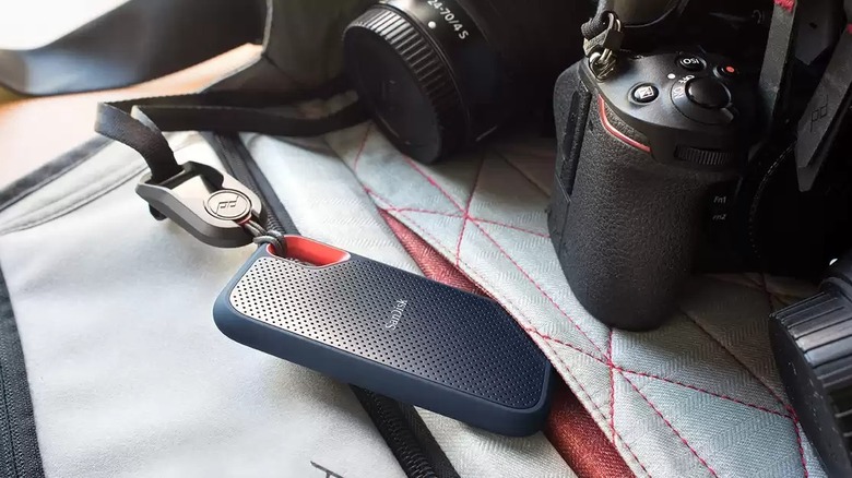 SanDisk 1TB Extreme Portable SSD in bag with camera