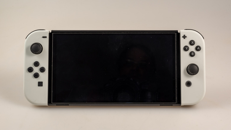 nintendo switch with the display turned off placed against a light background