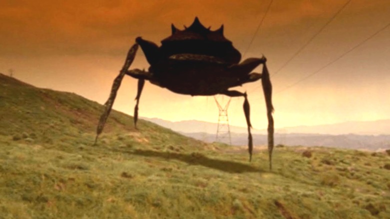 A crab like aliening walking on a hill in "H. G. Wells' War of the Worlds."