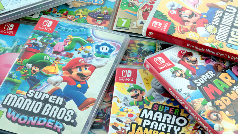 Various Nintendo Switch games in a pile.